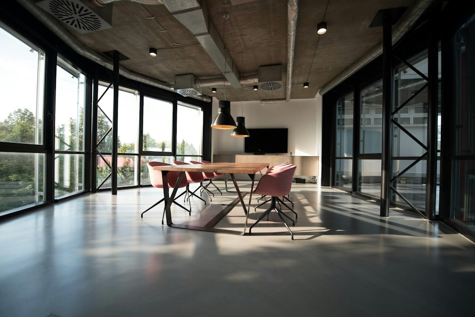 Sunlit creative studio with work tables and plants